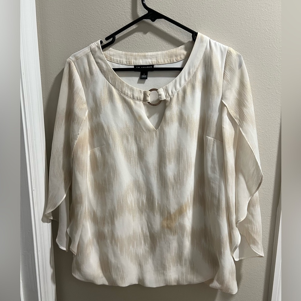 White blouse with gold detailing